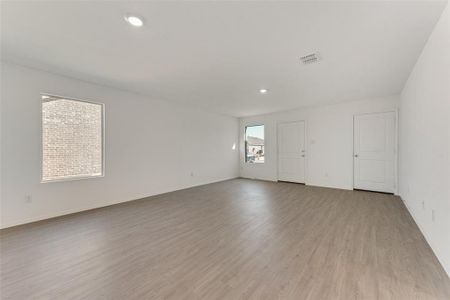 Empty room featuring light hardwood / wood-style floors