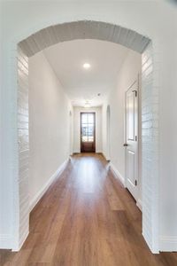 Corridor featuring hardwood / wood-style floors