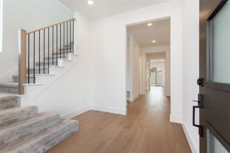 Staircase featuring wood-type flooring