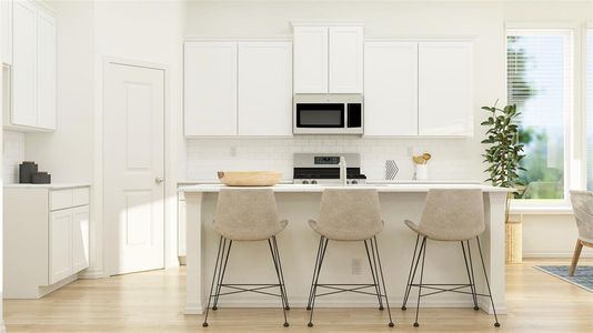 Kitchen featuring stainless steel appliances, white cabinetry, and a kitchen island with sink