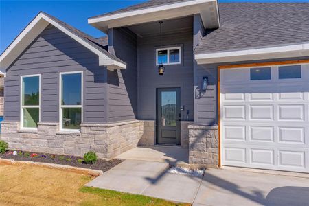 Property entrance featuring a garage