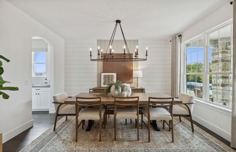 Formal dining area with large windows