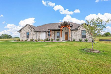 Craftsman inspired home with a front yard