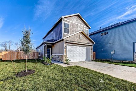 Framed by clear blue skies, this stunning home offers ample outdoor space, architectural details, and modern finishes, making it a standout in the community.