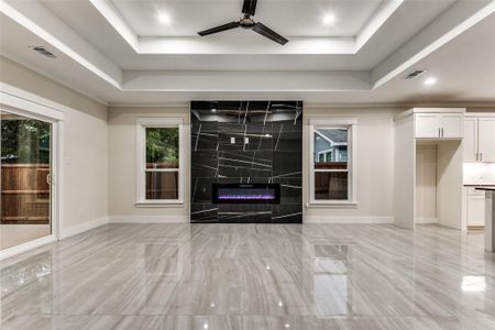 Breathtaking Living Room with upgraded tiles, double boxed ceiling!