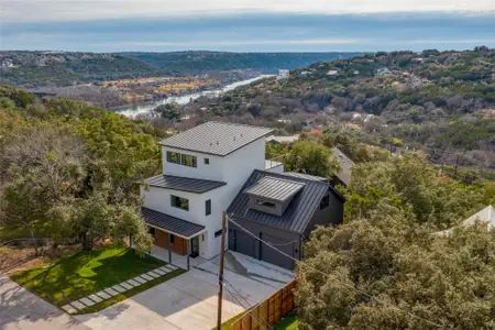 Birds eye view of property featuring a water view