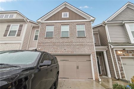 New construction Townhouse house 7621 Avalon Blvd, Fairburn, GA 30213 - photo 0