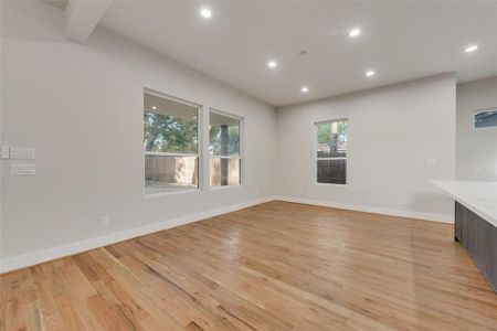 Unfurnished living room with light hardwood / wood-style floors