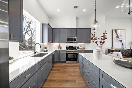 Modern kitchen with sleek cabinetry, stainless steel appliances, and elegant countertops, offering a perfect blend of style and functionality.