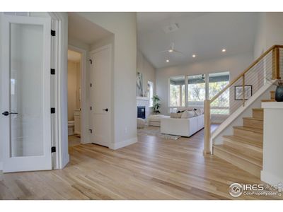 Vaulted ceilings and white oak flooring greet you in this open floor plan