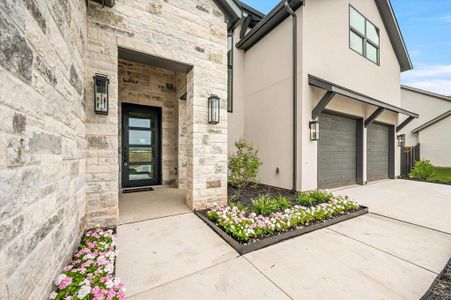 Doorway to property featuring a garage