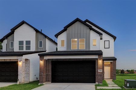 With a perfect balance of tradition and contemporary design, this 2-story retreat blends classic brick craftsmanship with a two-toned Hardie siding for a unique finish.