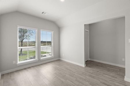 Craft enduring memories with loved ones around the table! This spacious dining area boasts stylish flooring, personalized paint, and is conveniently situated next to kitchen, fostering an open and inclusive ambiance. Sample photo of completed home with similar floor plan. As-built interior colors and selections may vary.