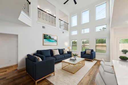 The expansive family room is the heart of this home, boasting soaring ceilings and a wall of windows that offer a seamless connection to the outdoors. This space is ideal for creating memories, whether you're hosting a movie night or enjoying a quiet moment by the window. The open layout flows effortlessly into the kitchen, making entertaining a breeze.