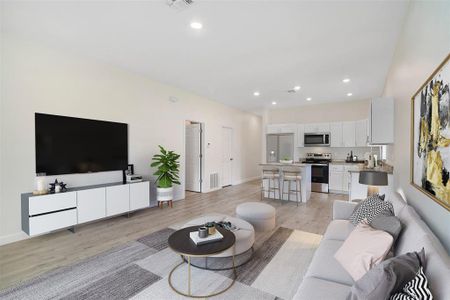 LIVING AREA/KITCHEN. Virtually Staged/Fridge is virtually staged.