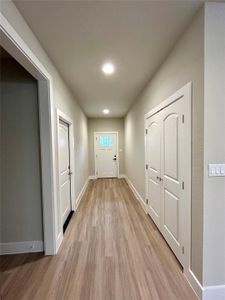 Entryway closet with double doors.