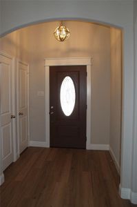 Foyer featuring dark wood-type flooring