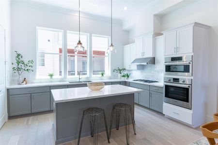 imilar home/ floor plan.  Actual has more contrast in cabinets creating a tuxedo look!