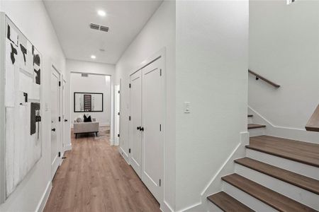 Hallway featuring light wood-type flooring