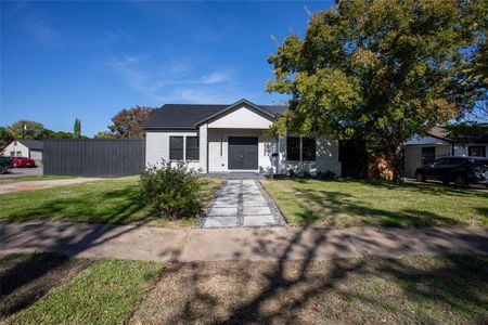 View of front of house with a front lawn