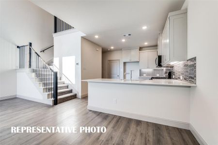 Your new dream kitchen features a breakfast bar that is the perfect place for a quick meal or for the kiddos to do homework.   REPRESENTATIVE PHOTO.