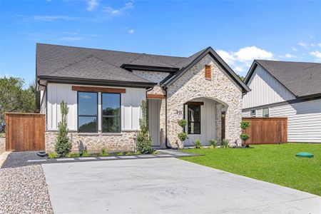 View of front of property with a front lawn