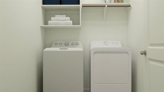 Laundry room featuring washer and clothes dryer