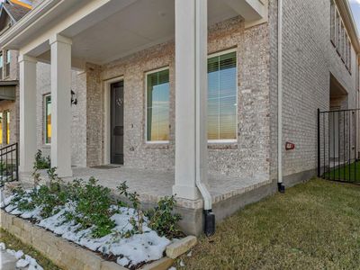 View of side of property featuring a porch