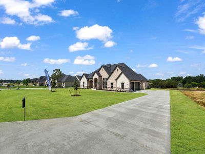 French country style house with a front yard