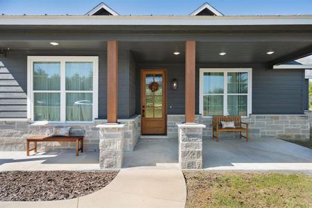 Property entrance featuring covered porch