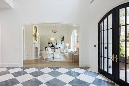 Foyer entrance featuring french doors and hardwood / wood-style floors