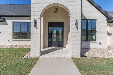 Property entrance featuring a yard