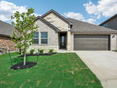 Front exterior of the the FItzhugh floorplan in a Meritage Homes community.