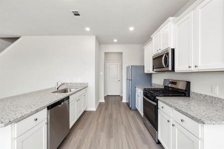 Kitchen with upgraded Whirlpool kitchen appliances.