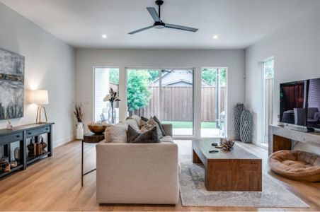 Spacious living room featuring lots of windows for natural light