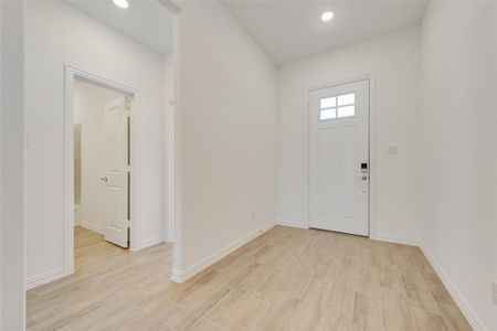 Entrance foyer featuring light hardwood / wood-style floors