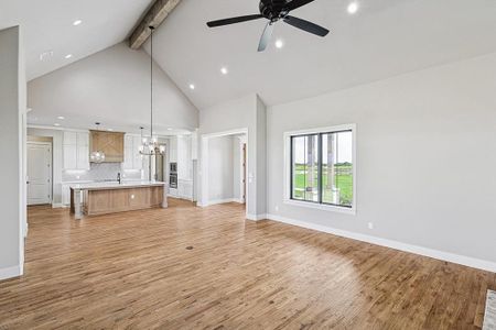 Living Room with Vaulted Ceiling, hand scraped hardwood floors.