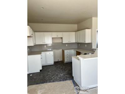 white cabinets, grey subway