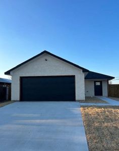 Ranch-style home featuring a two car garage