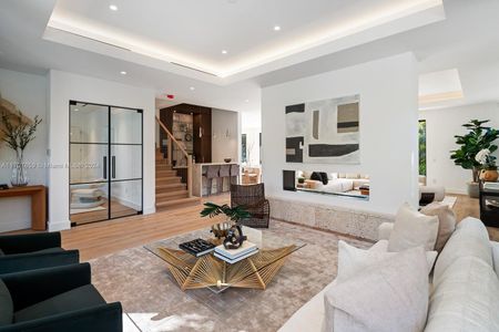 Formal Living Room Adjacent To Wet Bar And Library