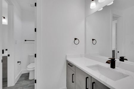 Bathroom featuring toilet and vanity