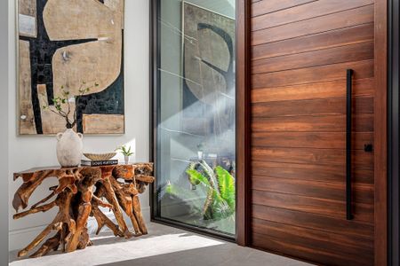 The homes wood pivot door.