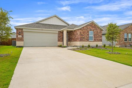 View of front facade with a garage and a front lawn