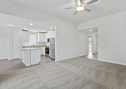 Open layout with views of the living room and the kitchen.