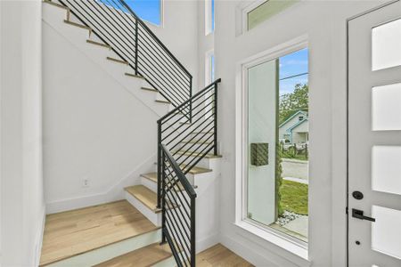 Stairway with hardwood / wood-style flooring