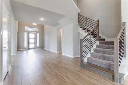 Unfurnished living room with light wood-type flooring