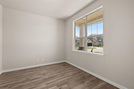 The home office features French doors, beautiful floors, large windows that give a fresh feel, this space promotes focus and creativity.