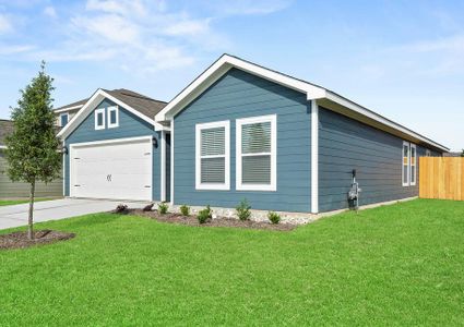 The front yard of the Sabine floor plan is landscaped.