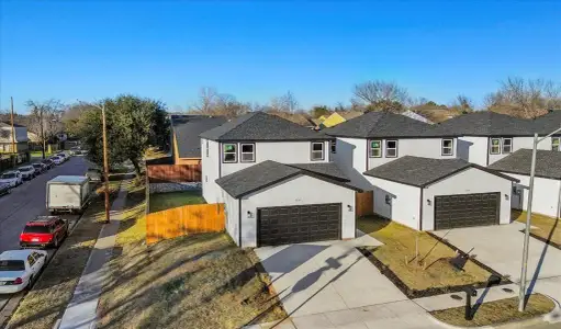 Front facade with a front yard and a garage