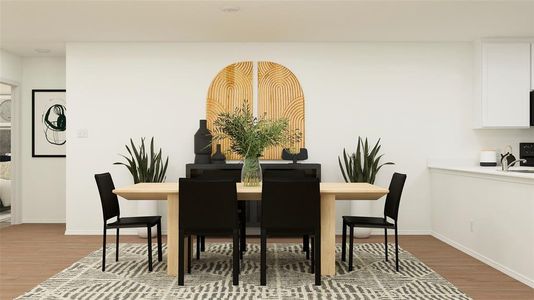 Dining area with hardwood / wood-style floors and sink